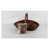 Handle basket with bag of cowrie shells, seller