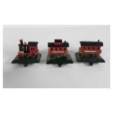 Three cast iron train stocking hangers, with