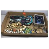 Flat of costume jewelry