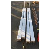 Four vinyl  white porch posts, 9 feet