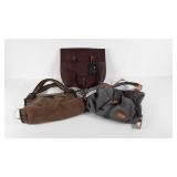 Three purses, two canvas and one leather like, all