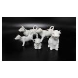 Five cow creamer pitchers