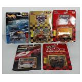 Five collectible cars in boxes, unopened,