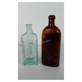 Two glass bottles, includes Warner