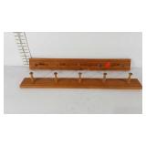 Pair of wooden wall mounted coat racks, Workshops