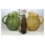 Two glass pitchers and a eagle top decanter does
