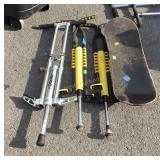 Four piece lot:  skateboard and three pogo