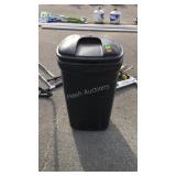 Home owners trashcan with open bag of zip ties