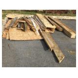 Assortment of wood posts, boards, chip board and