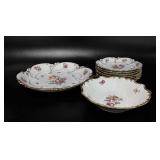 Floral porcelain plates, bowl and platter, marked
