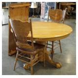 Round 48" dining table with a 24" leaf and two