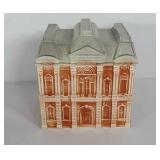 Ceramic house themed cookie jar, has flea bites