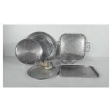 Metalwares group, includes serving trays, bowl,
