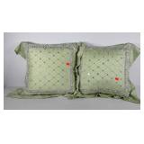Two beaded decorative throw pillows