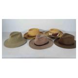 Five hats, most marked size L, straw and wool