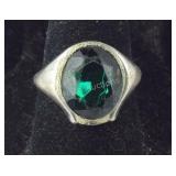 Sterling silver ring with faceted green stones