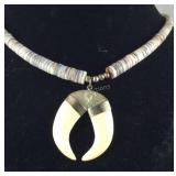 Necklace with shell beads and talons