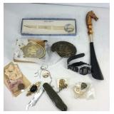 Two belt buckles, shoe horn, pocket knife, letter