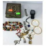 Tin storage box with beaded necklace, bracelets,