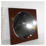 Wall mounted round mirror with wooden backing,