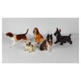 Five ceramic dog statues, most are made in Japan,