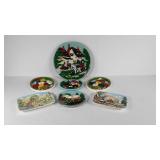 Seven painted relief wall hangings, plaster and