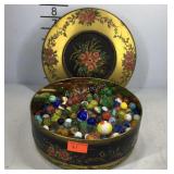 Cookie tin filled with marbles