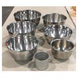 Six mixing bowls and aluminum cup