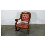Upholstered rocking chair,  repaired in one spot