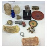 Glass insulator, razor, toy gun, tape measure,