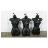 Three female torso mannequin forms, hollow back,