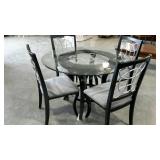 Glass topped table with four chairs, 48" diameter