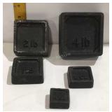 Five cast weights 4 ounces, 8 ounces, 1 pound, 2