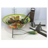 Kitchenware, tin metal bowl with potato masher,