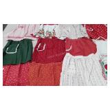 Apron collection, eleven, several are holiday
