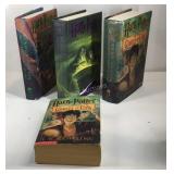 Four Harry Potter books, 3 are hardback. Harry