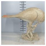 Heavy pottery bird statue, is chipped on corner