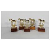 5 horse trophy toppers on wooden bases