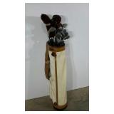 Vinyl golf bag with clubs, zipper is broken