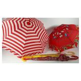 Five umbrellas including child