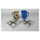 Two pottery pitchers and dip bowls shaped like