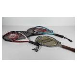 Three racquetball racquets with covers