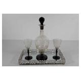 Glass ribbed decanter with two glasses on