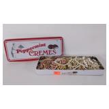 Tin of costume jewelry, some loose beads as shown