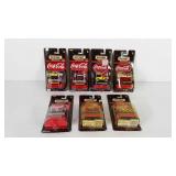 Seven Coca-Cola Mattel Matchbox vehicles,  all