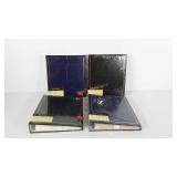 Four photo albums, new in packaging, seller code