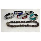 Five costume bracelets and a beaded necklace