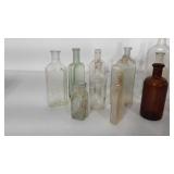 16 assorted glass bottles and flasks.  McCormick