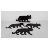 Yard art, four metal cats with marble eyes, three