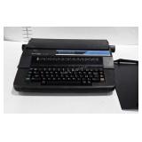 Sharp Electric Typewriter, plugged in and powers